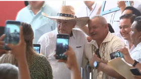 What social distancing? Mexican president defies Covid-19 concerns as he EMBRACES & SHAKES HANDS with 1000s at rallies (VIDEOS)