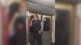 Hedge fund guy in hot water after licking finger & wiping Hong Kong metro handrail in ill-conceived ‘fake news’ stunt (VIDEOS)