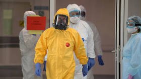 Putin gets bonus trust points for nailing the hazmat suit appearance first