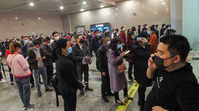 Hubei residents swarm trains as coronavirus lockdown is LIFTED at last (PHOTOS, VIDEOS)