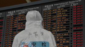 China drastically reduces international flights in move to curb imported coronavirus cases