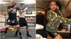 'Striving to be the best father possible': Mayweather trains with son Koraun after daughter Yaya arrested in 'stabbing incident'