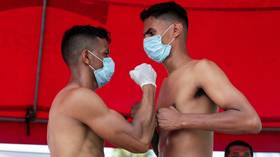 Masked staredown: Boxers face off in Nicaragua while wearing FACE MASKS as event goes ahead in Central America (PHOTOS)
