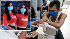 The show goes on: Ring girls in MASKS and social distancing in the crowd as boxing event goes ahead in Nicaragua (PHOTOS)