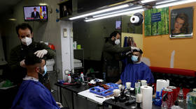 Shops, hair salons and bookstores reopen in Spain as rate of Covid-19 infections & deaths drop