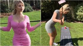 'How?!' Golf model Lucy Robson wows fans with overhead trick-shot putt (VIDEO)