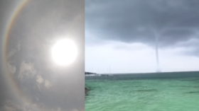 Nature unloads on Cancun, Mexico with waterspout, solar halo, lightning, wind & hail (VIDEOS)
