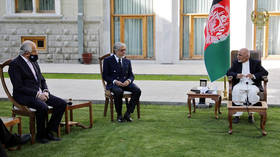Taliban deal: US envoy meets Afghan president, former rival as Kabul ends political impasse