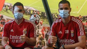 'They're animals!' Benfica condemn 'CRIMINALS' after team bus is STONED in attack