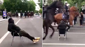 WATCH protester chilling in lounge chair as mounted police charge at him at Brussels BLM protest