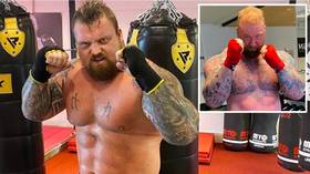 'Putting that GRAFT in': Eddie Hall shows SHREDDED physique as strongman prepares to box 'Game of Thrones' giant Bjornsson