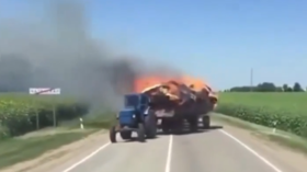 Hay Satan! WATCH ‘tractor of apocalypse’ catch fire on Russian road & set fields ablaze