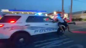 Detroit police filmed driving SUV through crowd of protesters in blood-chilling VIDEO