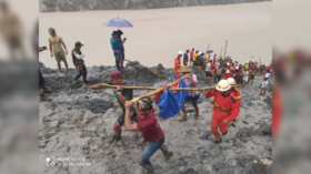 At least 100 killed by monsoon-triggered mudslide at jade mine in Myanmar