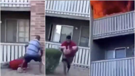 WATCH: Heart-stopping moment former college football player catches 3yo child thrown from burning building (VIDEO)