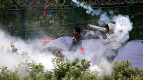 French police dismantle makeshift shelter camp in Calais, removing hundreds of migrants