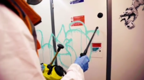 Banksy shares rare VIDEO of himself tagging London Tube with Covid-themed graffiti