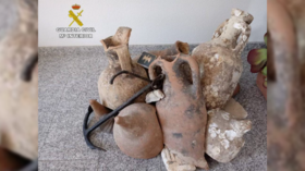 Fishy business: Spanish police investigating father and son who decorated their seafood store with ancient Roman urns (VIDEOS)