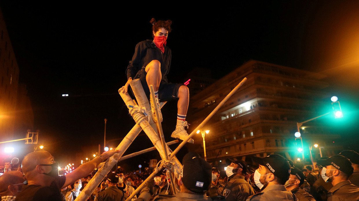 People protest against Israeli PM Benjamin Netanyahu's alleged corruption and economic hardships in Jerusalem on August 22, 2020.