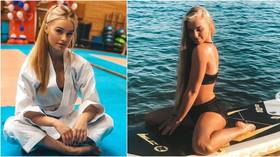 'How many times did I fall off?' Russian 'karate Barbie' makes waves with paddleboard pics at sun-soaked training camp (PHOTOS)