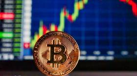Bitcoin briefly breaks past $12,000, hitting 1-year high
