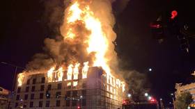 Massive fire engulfing an apartment complex is filmed from all over downtown St. Paul, Minnesota
