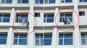 WATCH heroic Indian doctor rescue Covid-19 patient who attempted to jump FOUR FLOORS down from hospital building