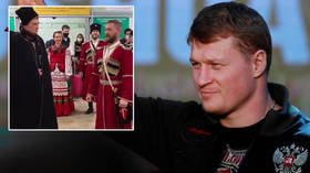 Russian heroes: Boxing star Povetkin is met by a COSSACK CHOIR at airport as crowds line streets for new MMA champ Nemkov (VIDEO)