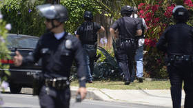 Reports of shots fired at pro-Trump caravan in LA suburb, suspect on the run after standoff with police