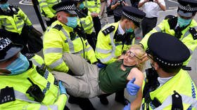 ‘Flipping nuisance’: Senior UK cop blasts Extinction Rebellion activists’ tactic of ‘GOING ALL FLOPPY’ to make arrests harder