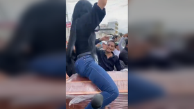 Mourning woman TWERKS ON COFFIN in bizarre Ecuadorian funeral (VIDEO)