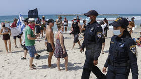 Bikini-clad Israelis rally against Covid-19 lockdown at Tel Aviv BEACH protest (PHOTOS, VIDEOS)