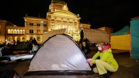 Climate activists chain themselves to objects at ‘occupation’ camp outside Swiss parliament