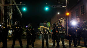 Black Los Angeles cop harassed with slurs by protesters in 'demon masks' (VIDEO)