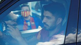 Back together: Luis Suarez drives best friend Messi to the airport as ex-Barcelona pairing head to internationals together (VIDEO)