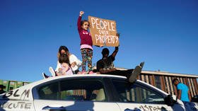 Black Los Angeles cop harassed with slurs by protesters in 'demon masks' (VIDEO)