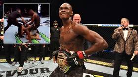 'The DISRESPECT!': Israel Adesanya 'air humps' stricken rival Paulo Costa after brutal TKO victory in UFC 253 title fight (VIDEO)
