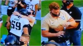 WATCH: American football player almost KOs coach after headbutting him with helmet on