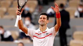 'Not even breaking a sweat': Novak Djokovic breezes into Roland-Garros second round as US Open row seems far behind him