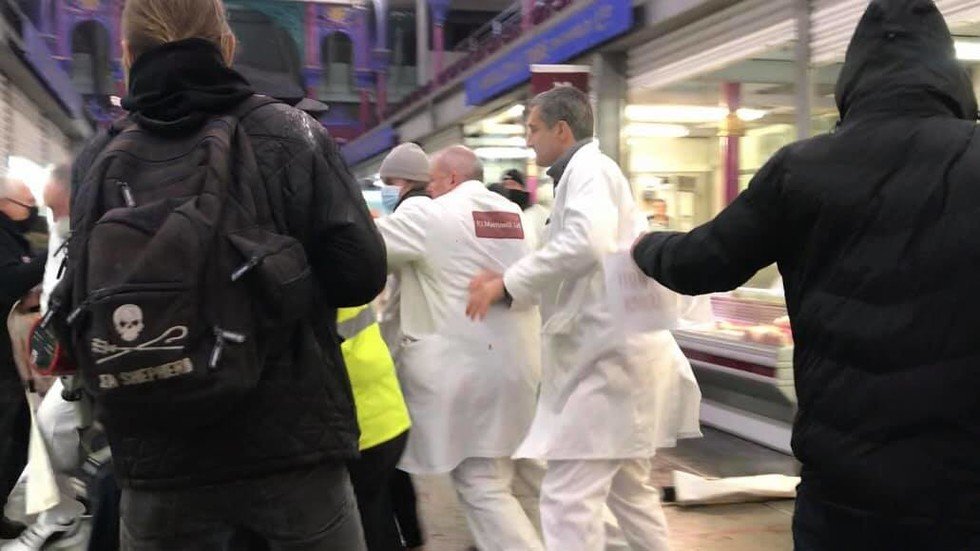 WATCH: Butchers chase animal rights activists out of London meat market ...