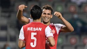 Iranian footballer hit with 6-month ban for 'eye-slant' celebration in Asian clash but star insists gesture is tribute to nephew