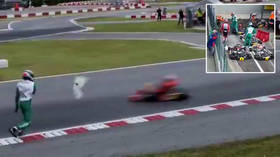 'What on Earth is he doing?' Karting ace stuns fans by HURLING BUMPER at cars in 'absolutely unacceptable' attack on track (VIDEO)