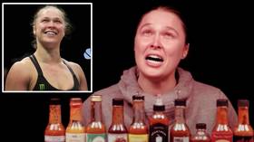 'My tears are BURNING my face!' UFC Hall of Famer Ronda Rousey left CRYING during HOT WINGS challenge (VIDEO)