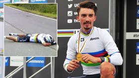 Down and out: Cycling world champ SCREAMS in pain after FLIPPING over top of bike in agonizing crash with race motorcycle (VIDEO)