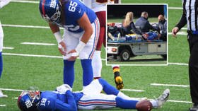 KNOCKED OUT: NFL player SLUMPS to the ground after taking hit before being carted out of game with 'scary neck injury' (VIDEO)