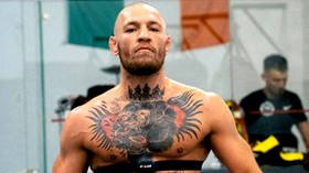 'I'm RARING to go: Ex-UFC champ Conor McGregor leaves little to the imagination in training photo as he looks RIPPED in the gym