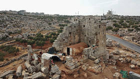 Displaced Syrians settle in ancient Roman ruin instead of ‘overcrowded’ refugee camps amid Covid-19 pandemic (PHOTOS)