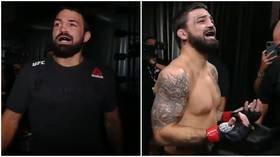 ‘What the f*ck?’: Hilarious scenes as Mike Perry walks out to WRONG SONG at UFC 255... but sings along anyway (VIDEO)