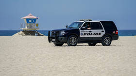 Protesters in Huntington Beach, California block traffic in defiance of new Covid-19 curfew (VIDEOS)