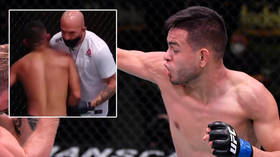 ‘I'm heartbroken’: Fighter left in agony as coach casually pops shoulder back in place in excruciating end to UFC 255 bout (VIDEO)